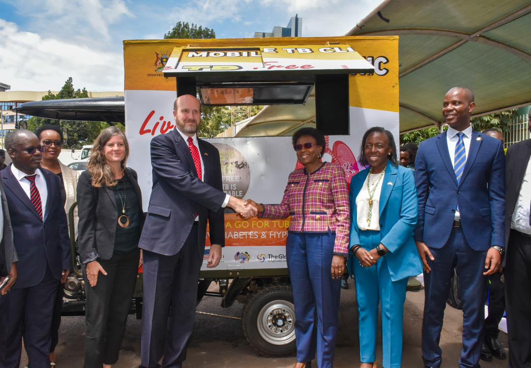 USA Ambassador handing over the Tuktuks to the
                Minister of Health Dr.Jane Ruth Aceng